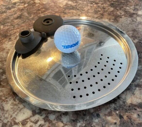 Golfboll blir knopp på lock